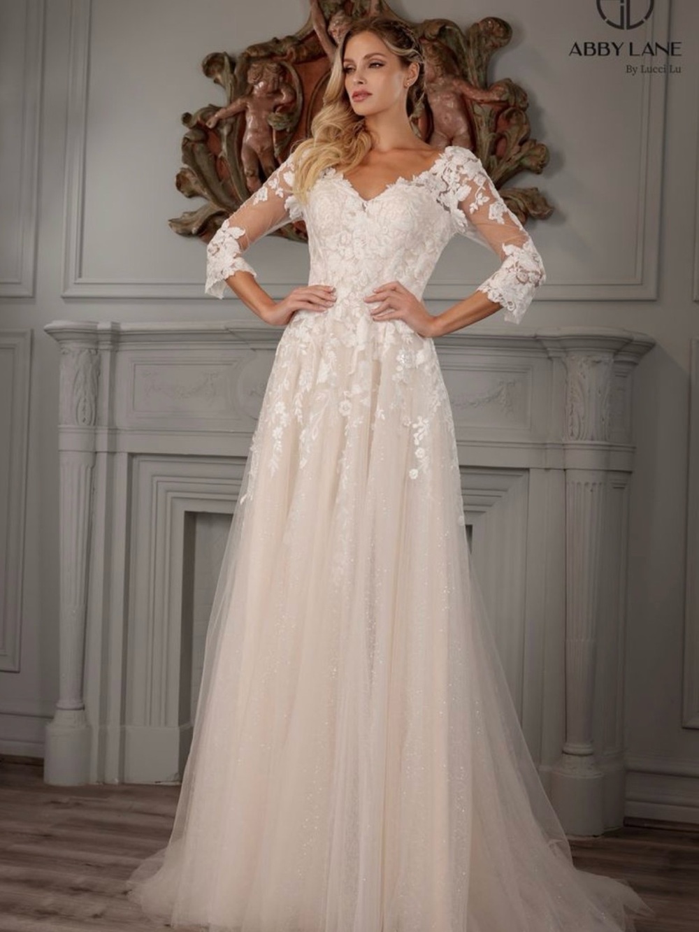 Abby Lane Ivory Lace Bridal Gown with Sheer Three-Quarter Sleeves